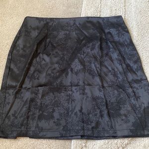 New never worn black silk mini skirt